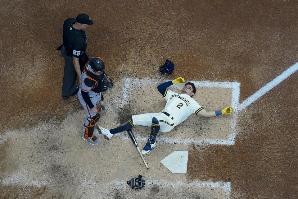 Milwaukee Brewers' Luis Urias reacts after being hit by a pitch during the sixth inning of game 2 of a doubleheader baseball game against the San Francisco Giants Thursday, Sept. 8, 2022, in Milwaukee. (AP Photo/Morry Gash)