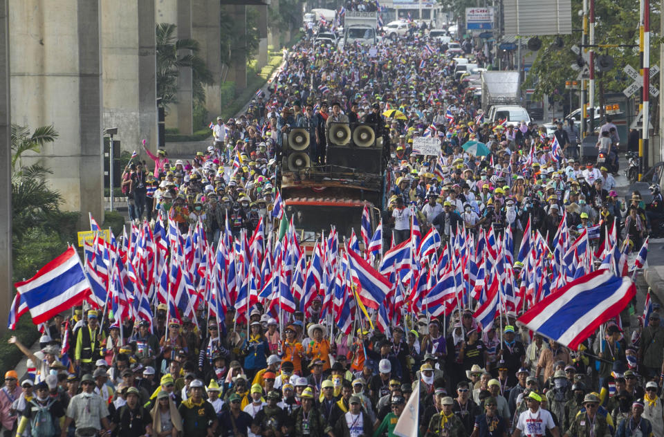 Thai anti-government protesters pack a street during a rally Friday, Jan. 17, 2014 in Bangkok, Thailand. Dozens of people were wounded in Thailand's capital Friday when a grenade blast ripped through a crowd of marching anti-government demonstrators, an ominous development that raises tensions in the country's political crisis and the specter of more bloodshed to come. (AP Photo/Wason Wanichakorn)