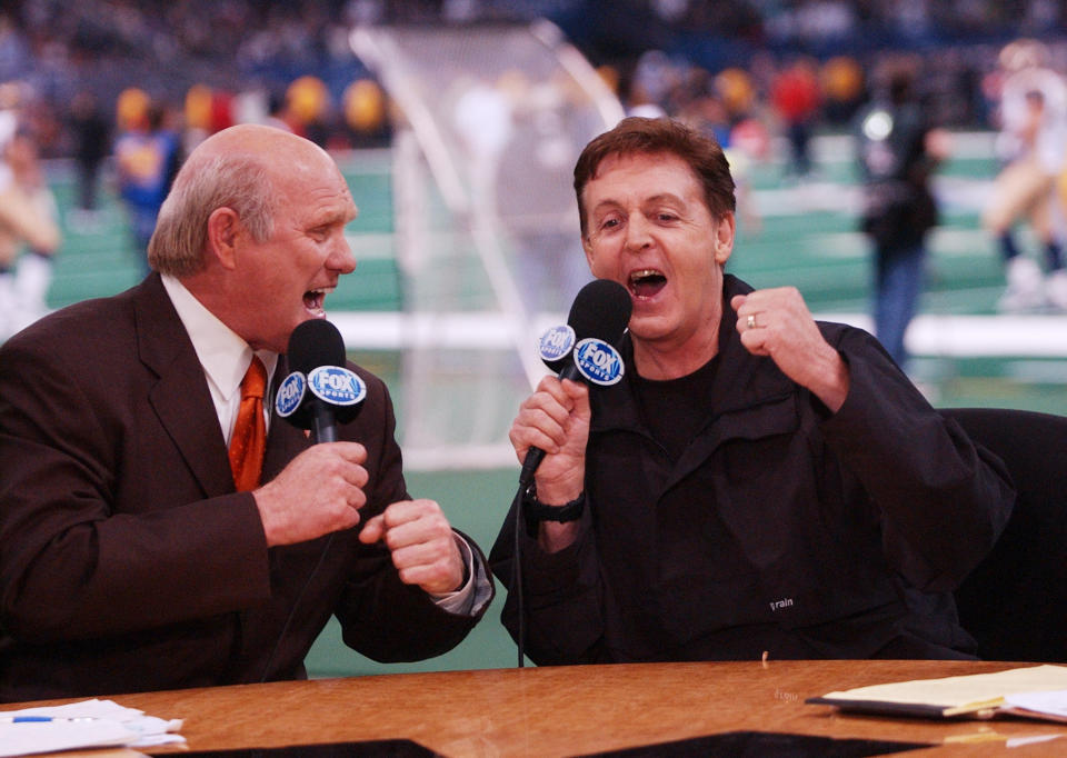 Fox Sports broadcaster Terry Bradshaw and Sir Paul McCartney sing a duet of 'A Hard Day's Night' during the halftime show of Super Bowl XXXVI at the Superdome in New Orleans, Louisiana February 3, 2002.&nbsp;