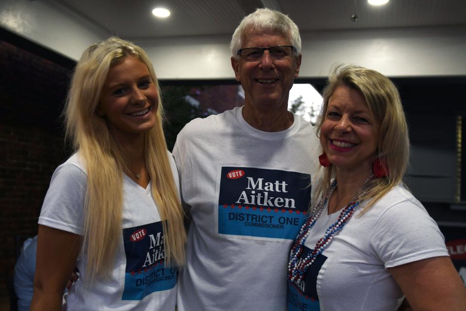 Augusta Commission District One candidate Matt Aitken (center) poses for a photo with wife Melissa Aitken (right) and daughter Cecilia Aitken (left) at his watch party at the Aitken's home on Tuesday, May 21, 2024.