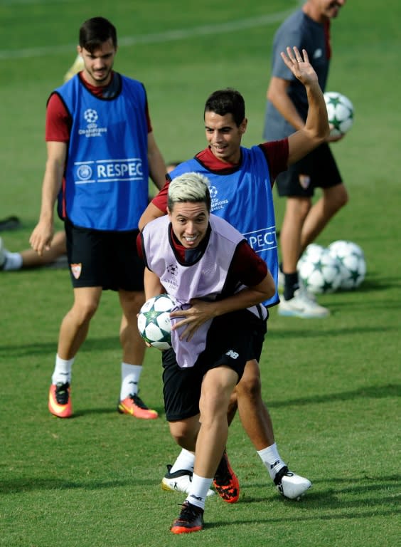 Sevilla's midfielder Samir Nasri (C) attends a training session on September 26, 2016