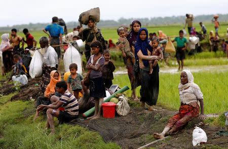 Rohingya refugees rest after travelling over the Bangladesh-Myanmar border in Teknaf, Bangladesh, September 1, 2017. REUTERS/Mohammad Ponir Hossain