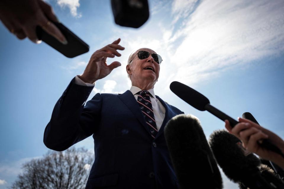 Joe Biden talks to the press on the South Lawn of the White House before boarding Marine One on March 28, 2023 in Washington, DC, for a trip to Durham, North Carolina.