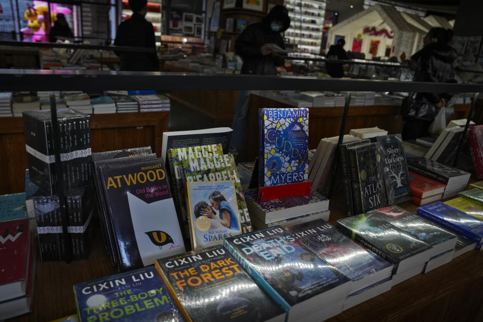 Copies of "The Three-Body Problem" on display at a bookstore in Beijing on Monday, Feb. 19, 2024. The series, written by former engineer Liu Cixin, helped Chinese science fiction break through internationally, winning awards and making it onto the reading lists of the likes of former U.S. President Barack Obama and Mark Zuckerberg. (AP Photo/Andy Wong)