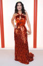 <p>Salma Hayek brings the heat in a copper sequin gown with halter neckline, keyhole cutout and fringed skirt. </p>