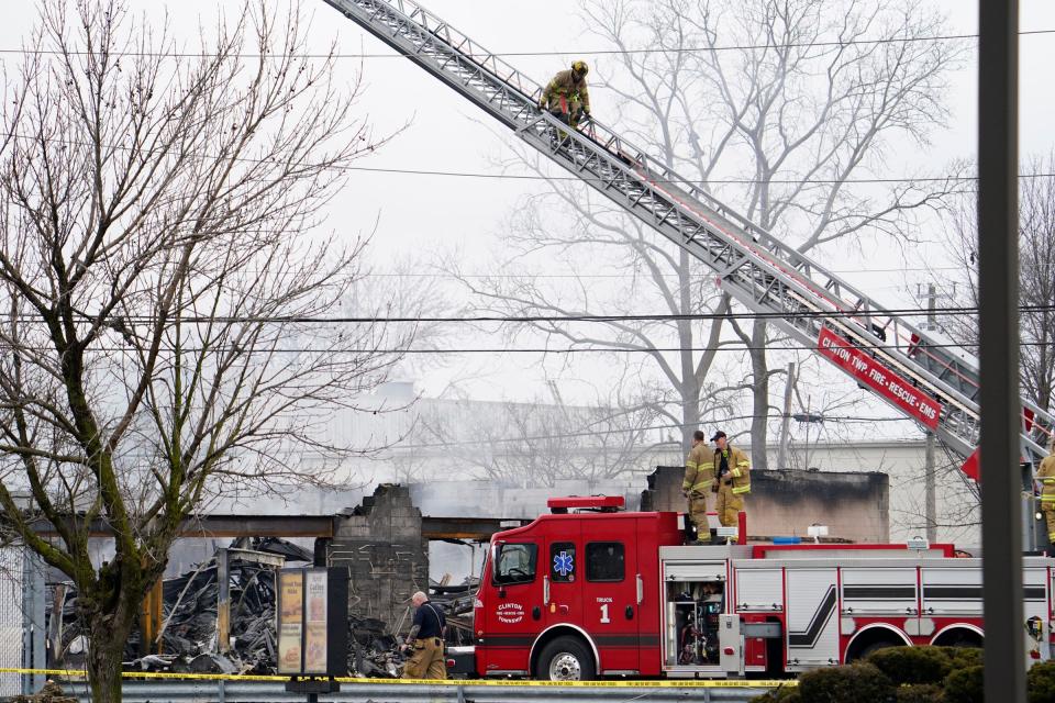 Clinton Township fire fighters continue to extinguish hot spots that can be seen rising on Tuesday, March 5, 2024 after multiple explosions occurred last night at the Select Distributors in Clinton Township at 15 Mile Road.