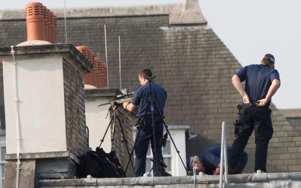 Armed police take position on a building over looking the Palace of Westminster. - Credit: Nick Edwards for The Telegraph