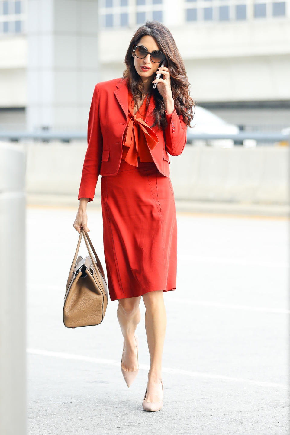 Amal Clooney returns to work at the UN in a stunning red skirt suit