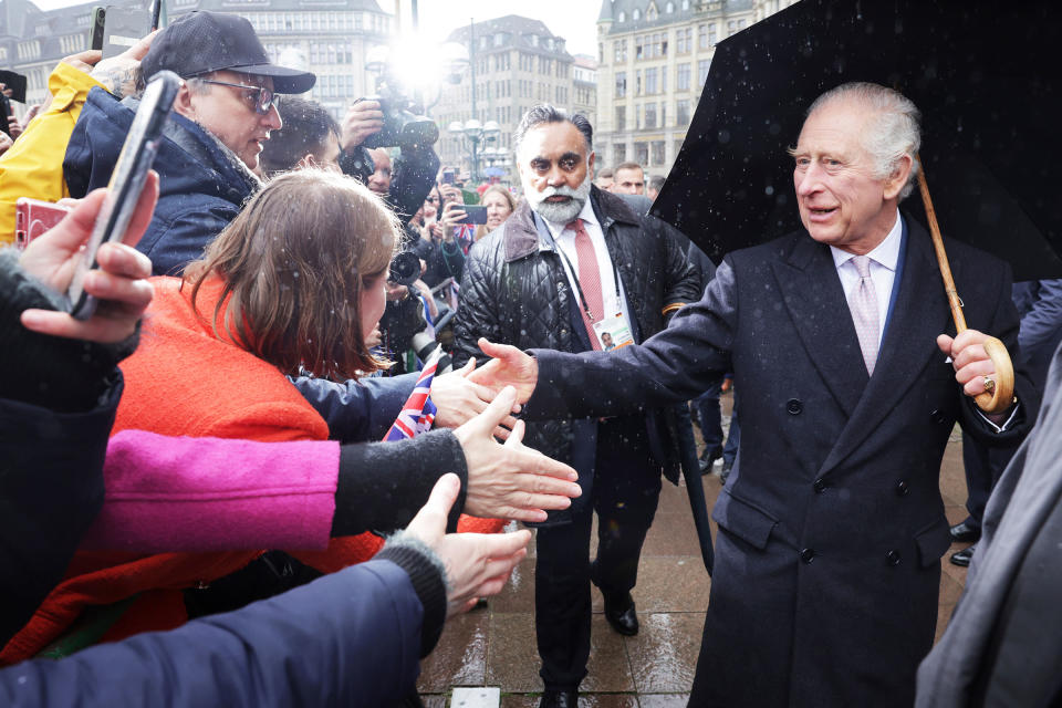 King Charles III greets members of the public during a walkabout outside Hamburg City Hall, the seat of the Hamburg government, on the final day of the King and Queen's State Visit to Germany on March 31, 2023.<span class="copyright">PA Wire/AP</span>