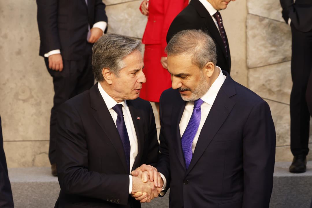 United States Secretary of State Antony Blinken, left, speaks with Turkey's Foreign Minister Hakan Fidan during a group photo of NATO foreign ministers at NATO headquarters in Brussels, Wednesday, April 3, 2024. NATO foreign ministers gathered in Brussels on Wednesday to debate plans to provide more predictable, longer-term support to Ukraine. (AP Photo/Geert Vanden Wijngaert)