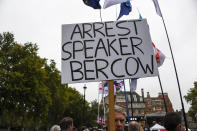A placard reading 'arrest Breach now' is pictured outside the Houses of Parliament, in London, Monday, Oct. 14, 2019.(AP Photo/Alberto Pezzali)