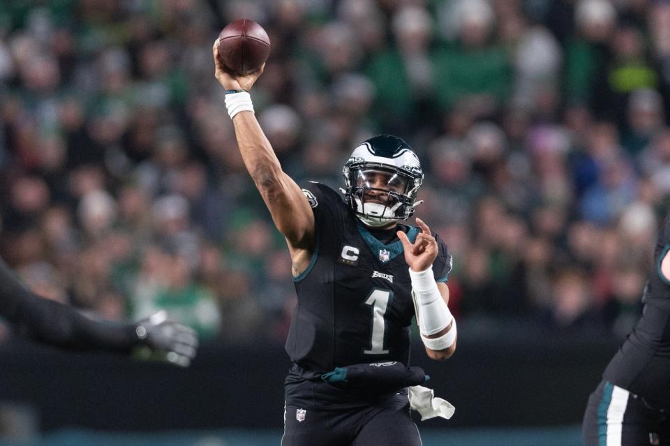 Dec 25, 2023; Philadelphia, Pennsylvania, USA; Philadelphia Eagles quarterback <a class="link " href="https://sports.yahoo.com/nfl/players/32723" data-i13n="sec:content-canvas;subsec:anchor_text;elm:context_link" data-ylk="slk:Jalen Hurts;sec:content-canvas;subsec:anchor_text;elm:context_link;itc:0">Jalen Hurts</a> (1) throws a touchdown pass to wide receiver <a class="link " href="https://sports.yahoo.com/nfl/players/33398" data-i13n="sec:content-canvas;subsec:anchor_text;elm:context_link" data-ylk="slk:DeVonta Smith;sec:content-canvas;subsec:anchor_text;elm:context_link;itc:0">DeVonta Smith</a> (not pictured) during the second quarter against the New York Giants at Lincoln Financial Field. Mandatory Credit: Bill Streicher-USA TODAY Sports