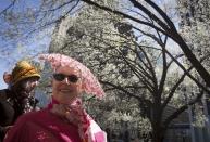Women attend the annual Easter Bonnet Parade in New York April 20, 2014. REUTERS/Carlo Allegri (UNITED STATES - Tags: SOCIETY)