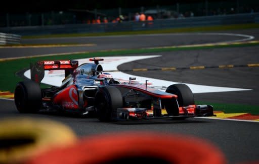 McLaren Mercedes' British driver Jenson Button drives during the third practice session at the Spa-Francorchamps circuit ahead of the Belgium Formula One Grand Prix. Button took his first pole position for McLaren when he clocked the fastest time during qualifying for Sunday's Belgian Grand Prix