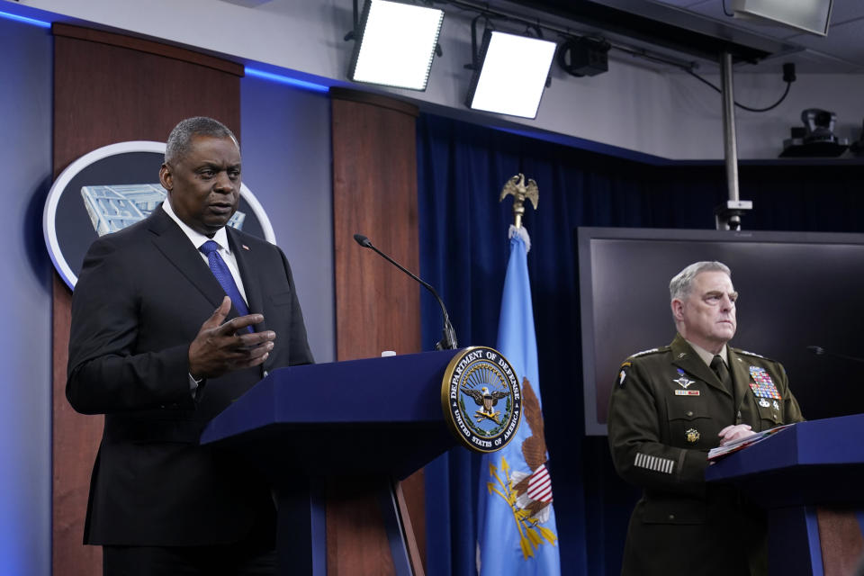 Defense Secretary Lloyd Austin, left, and Chairman of the Joint Chiefs of Staff Gen. Mark Milley, right, participate in a briefing at the Pentagon in Washington, Thursday, May 6, 2021. (AP Photo/Susan Walsh)