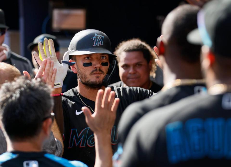 Marlins’ Miguel Rojas is congratulated after his sixth-inning home run against the Atlanta Braves in a baseball game Saturday, May 28, 2022, in Atlanta. (AP Photo/Bob Andres)