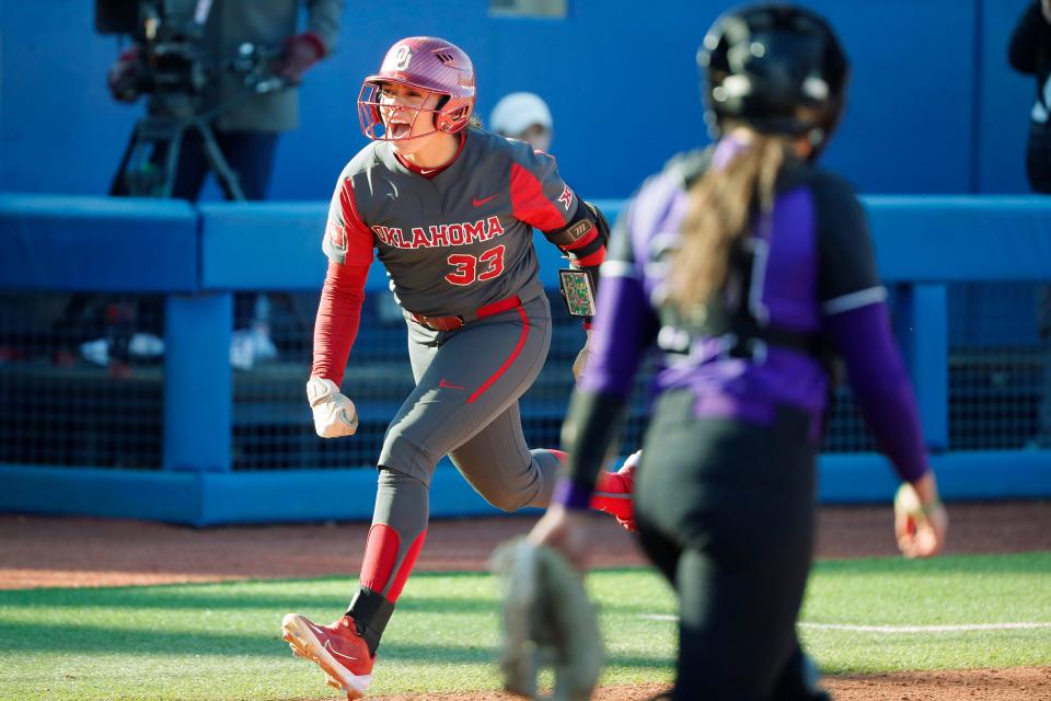 Oklahoma's Alyssa Brito celebrates after hitting a home run in the third inning of a college softball game between the University of Oklahoma Sooners (OU) and Weber State at USA Softball Hall of Fame Stadium in Oklahoma City, Friday, March 17, 2023. Oklahoma won 9-1. 