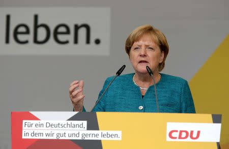 German Chancellor Angela Merkel, a top candidate of the Christian Democratic Union Party (CDU), attends an election rally ahead of the upcoming federal election in Annaberg-Buchholz, Germany August 17, 2017. REUTERS/Matthias Schumann