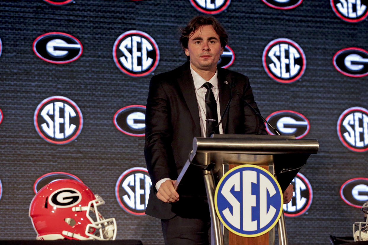 Georgia's JT Daniels speaks to reporters during a Southeastern Conference Media Days NCAA college football news conference, Tuesday, July 20, 2021, in Hoover, Ala. (AP Photo/Butch Dill)