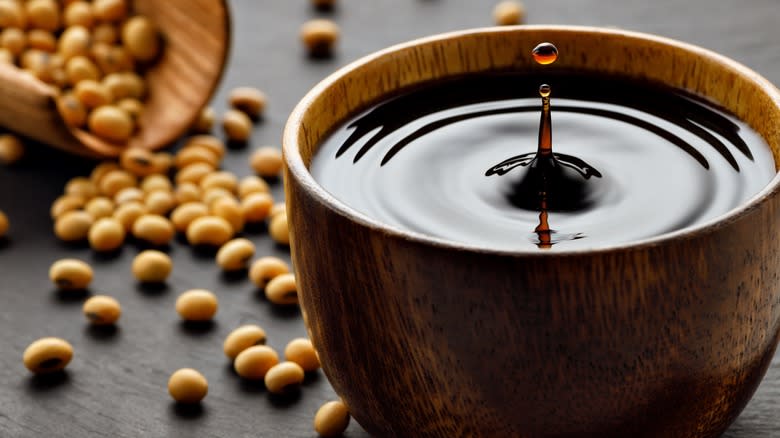 Soy sauce in wooden cup