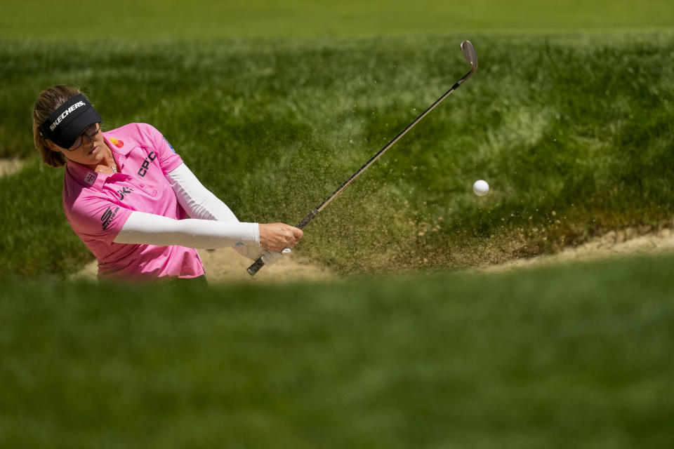 Brooke M. Henderson, of Canada, shoots out of a bunker on the 18th hole during a practice round for the Womens PGA Championship golf tournament at Sahalee Country Club, Wednesday, June 19, 2024, in Sammamish, Wash. (AP Photo/Lindsey Wasson)