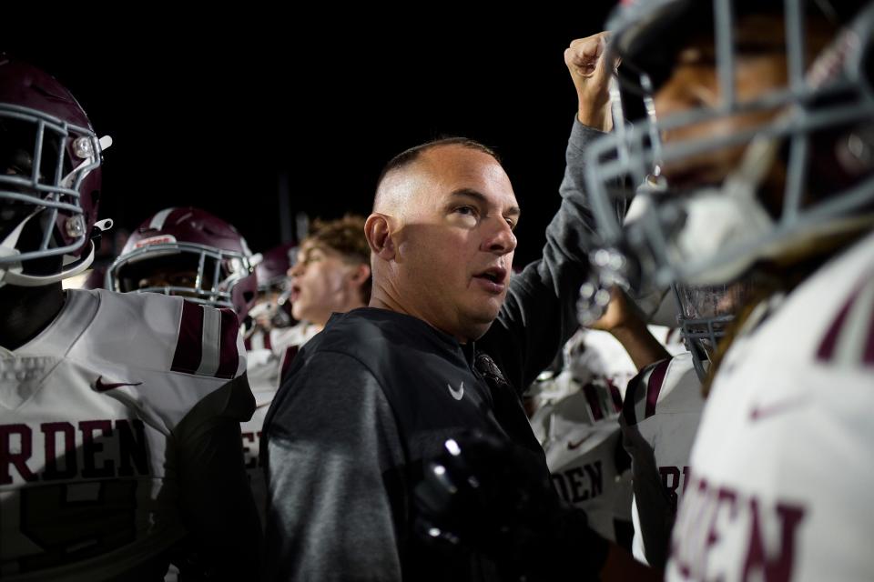 Bearden head coach Josh Jones huddles with the team before a Class 6A quarterfinals playoff game Nov. 11 at Maryville.