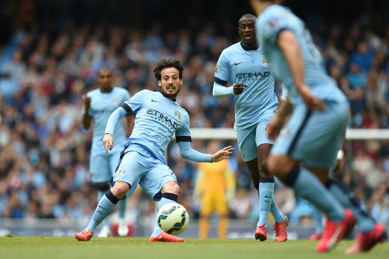 Manchester City midfielder David Silva (L) during the Premier League match against Southampton at the Etihad Stadium on May 24, 2015