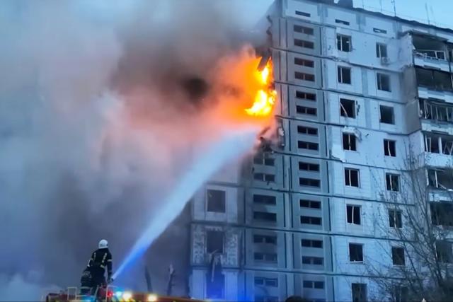 Firefighters work at an apartment building badly damaged by a Russian attack in the town of Uman (AP)