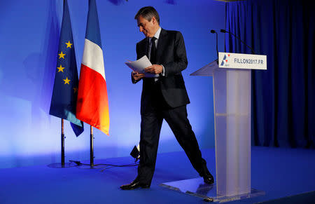 Francois Fillon, former French prime minister, member of the Republicains political party and 2017 presidential candidate of the French centre-right, leaves after a news conference to present his "project for France" in Paris, France, March 13, 2017. REUTERS/Philippe Wojazer