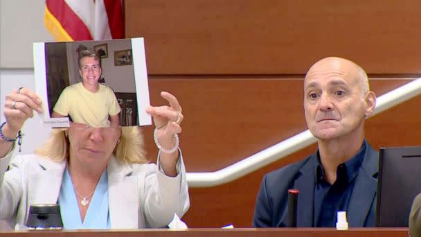 PHOTO: Mitch and Annika Dworet display a photo of their son Nicholas Dworet while giving their victim impact statements during the penalty phase of the trial of shooter Nikolas Cruz at the Broward County Courthouse in Fort Lauderdale, Fla., Aug. 2, 2022. (ABC News)