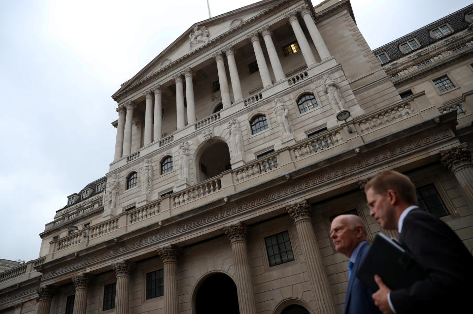 People walk past the Bank of England in the City of London, Britain, August 23, 2017. REUTERS/Hannah McKay