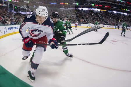 FILE PHOTO: Nov 12, 2018; Dallas, TX, USA; Columbus Blue Jackets left wing Markus Hannikainen (37) and Dallas Stars center Tyler Seguin (91) chase the puck during the game at the American Airlines Center. Jerome Miron-USA TODAY Sports