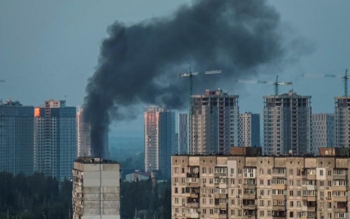 Smoke rises after a Russian missile strike on Kyiv