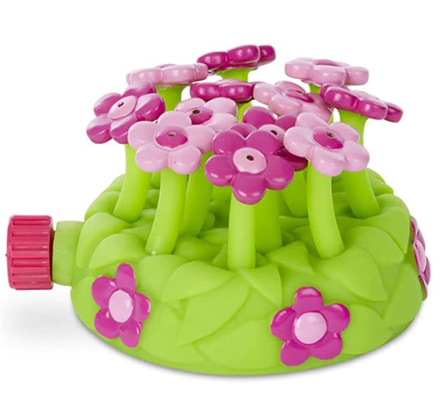 Find this Melissa &amp; Doug Sunny Patch Pretty Petals sprinkler toy that squirts water from each flower for $18 on <a href="https://amzn.to/3eNOnaz" target="_blank" rel="noopener noreferrer">Amazon.﻿</a>