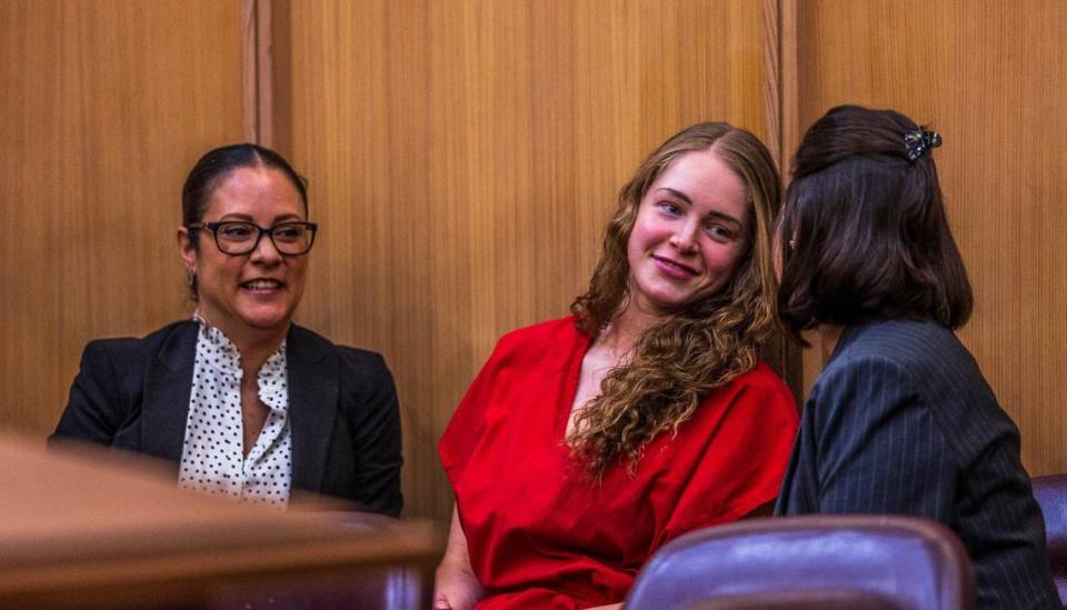 Defense attorneys Tara Kawass (left) and Dianne Caramés share a moment with OnlyFans model Courtney Clenney during a hearing in front of Miami-Dade Circuit Judge Laura Shearon Cruz, where the state dropped computer hacking charges against her and her parents Deborah and Kim Clenney, Thursday July 11, 2024.