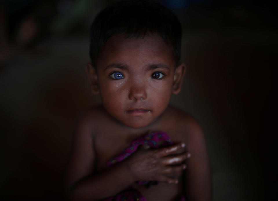 Hosne Ara, 4, a Rohingya refugee who fled Myanmar two months earlier, listens to children singing at a children's center in Kutupalong refugee camp near Cox's Bazar, Bangladesh, on Nov. 5. Reuters photographer Hannah McKay: "I was in a center for children photographing them singing. I could feel somebody watching me and when I turned 'round this little girl with extraordinary eyes was smiling at me. When I lifted my camera to take her picture she stopped smiling, as I lowered it she smiled again. It became a bit of a game and we were giggling with each other."