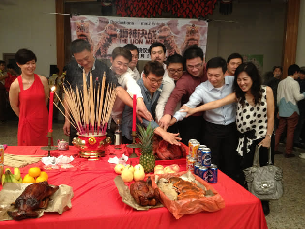 The opening ceremony for "The Lion Men" was laced with much fanfare--with Neo and his executive producers and crew collectively slicing a large suckling pig. (Yahoo! photo)