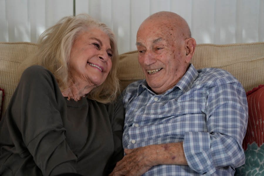 World War II veteran Harold Terens, 100, right, and Jeanne Swerlin, 96, share a laugh as they speak during an interview, Thursday, Feb. 29, 2024, in Boca Raton, Fla. Terens will be honored by France as part of the country’s 80th anniversary celebration of D-Day. In addition, the couple will be married on June 8 at a chapel near the beaches where U.S. forces landed. (AP Photo/Wilfredo Lee)