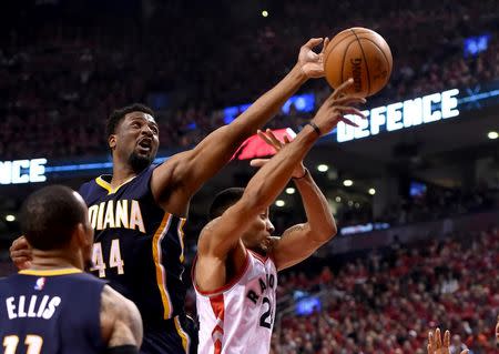 Indians Pacers forward Solomon Hill (44) reaches for the ball over Toronto Raptors guard Norman Powell (24) in game seven of the first round of the 2016 NBA Playoffs at Air Canada Centre. Mandatory Credit: Dan Hamilton-USA TODAY Sports