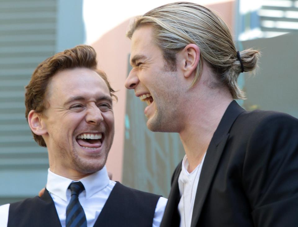 Actors Tom Hiddlestone (L) and Chris Hemsworth (R) attend "The Avengers" photocall at De Russie Hotel on April 21, 2012 in Rome, Italy.