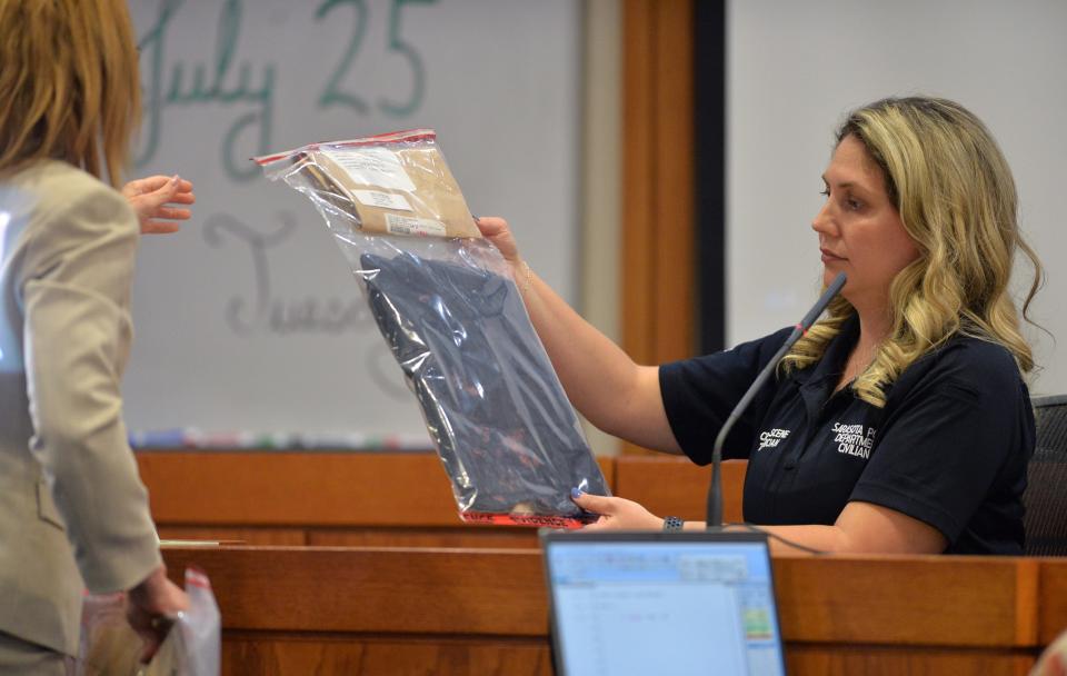 Assistant State Attorney Megan Leaf, left, questions Sarasota Police Department evidence technician Lee Kennedy about an article of clothing collected at the shooting scene. Darion Lee, 20, is charged with murder in the second degree with a firearm and attempted murder in the first degree with a firearm. Lee, who was 16 at the time, was arrested in November 2019 after he turned himself in following a shooting.