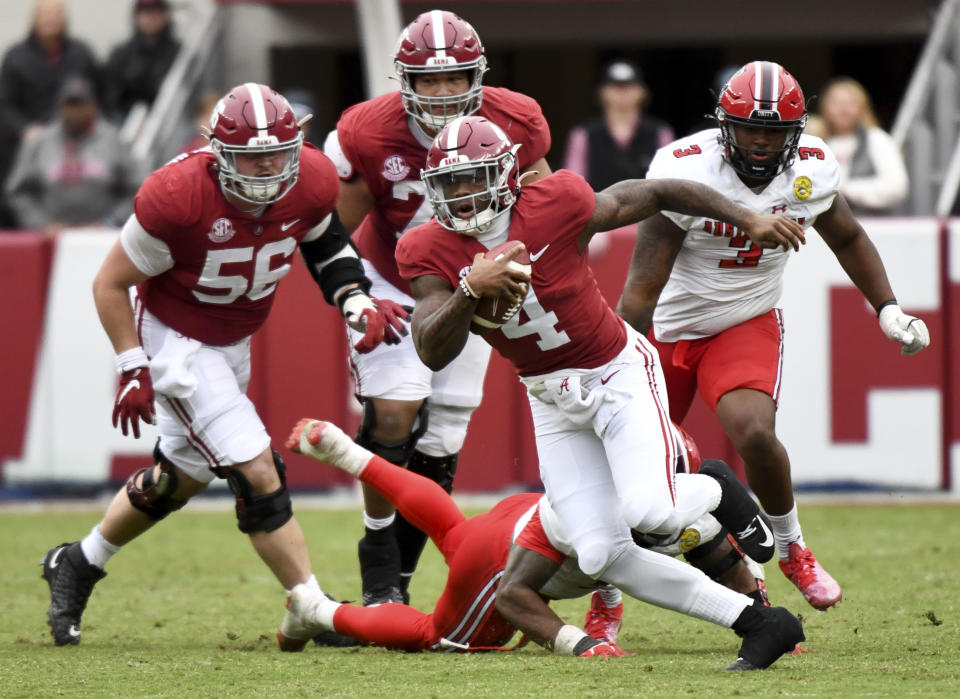Nov. 19, 2022; Tuscaloosa; Alabama quarterback <a class="link " href="https://sports.yahoo.com/ncaaf/players/323486" data-i13n="sec:content-canvas;subsec:anchor_text;elm:context_link" data-ylk="slk:Jalen Milroe;sec:content-canvas;subsec:anchor_text;elm:context_link;itc:0">Jalen Milroe</a> (4) runs the ball for a first down against Austin Peay at Bryant-Denny Stadium. Gary Cosby Jr.-USA TODAY Sports