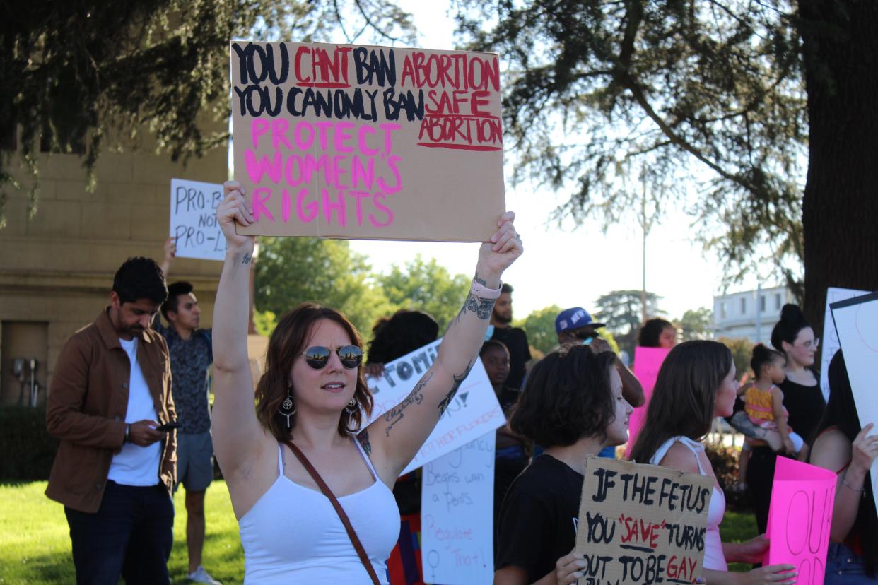 Brooke Santini chants as she displays a sign at a protest in front of Stockton City Hall on Saturday. The protest was organized to denounce the U.S. Supreme Court's decision to overturn Roe v. Wade.