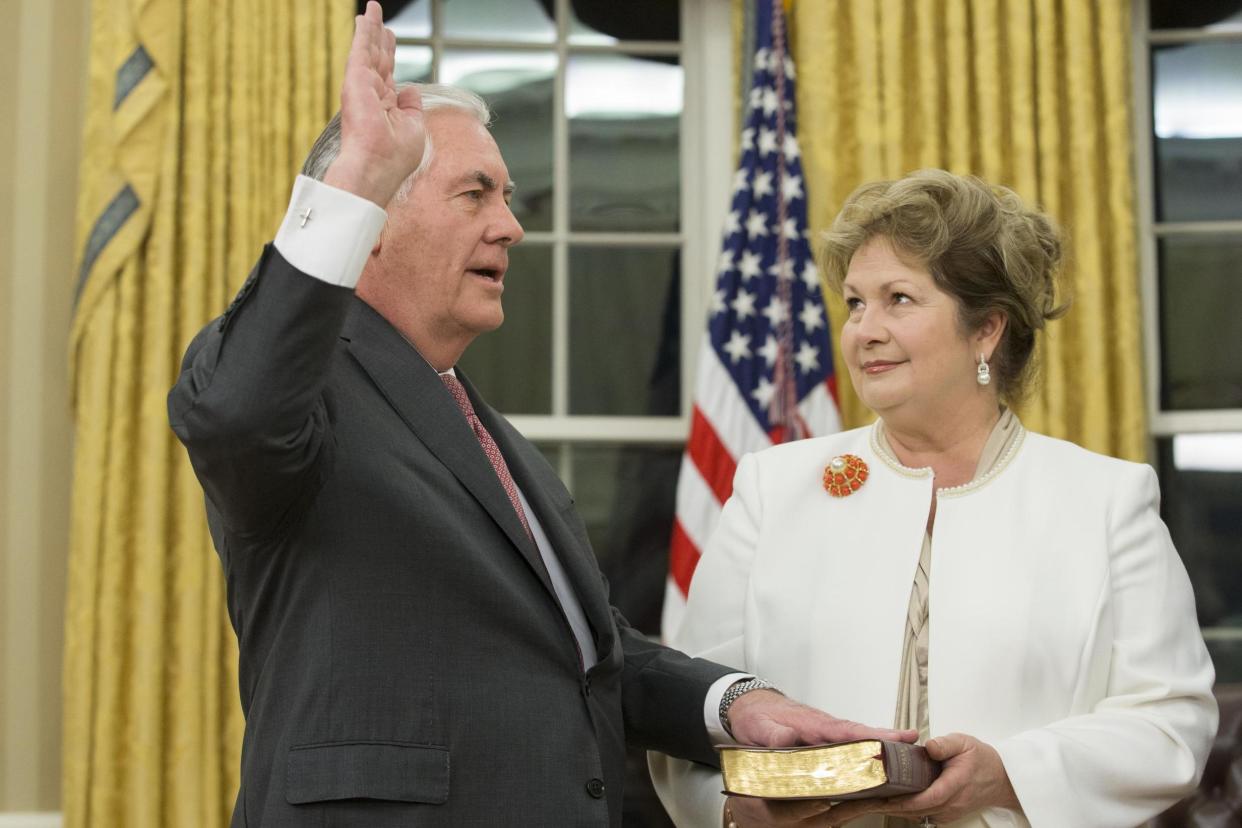 Swearing in: Rex Tillerson and his wife Renda St Clair, who reportedly convinced him to take the top job: Getty Images