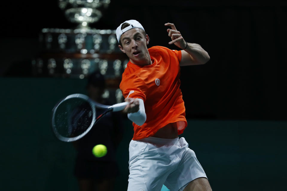 Netherland's Tallon Griekspoor returns the ball to Australia's Jordan Thompson during a Davis Cup quarter-final tennis match between Australia and The Netherlands in Malaga, Spain, Tuesday, Nov. 22, 2022. (AP Photo/Joan Monfort)