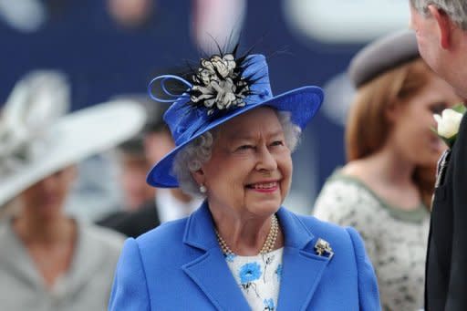 Britain's Queen Elizabeth II arrives on Derby Day, the second day of the Epsom Derby horse racing festival, in Surrey on June 2 -- the first official day of her Diamond Jubilee celebrations. She received a rapturous welcome from a flag-waving crowd of more than 100,000 at the racecourse Saturday as she kicked off four days of national celebrations