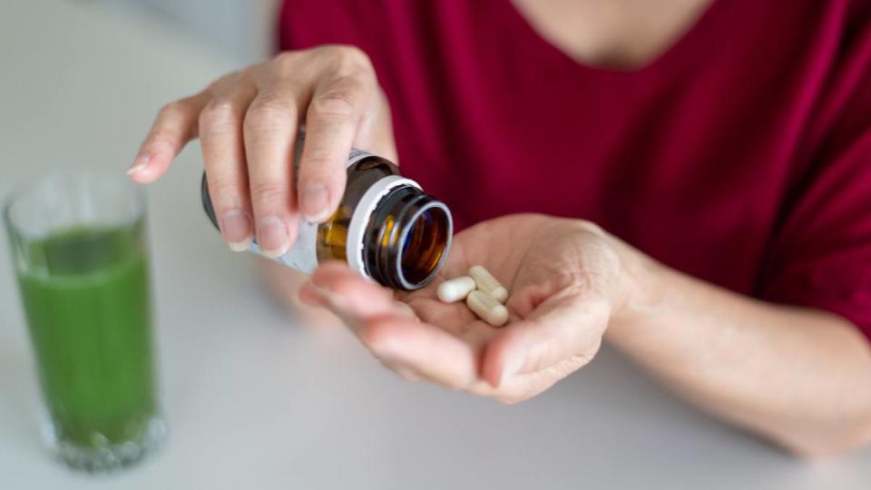 woman taking supplements