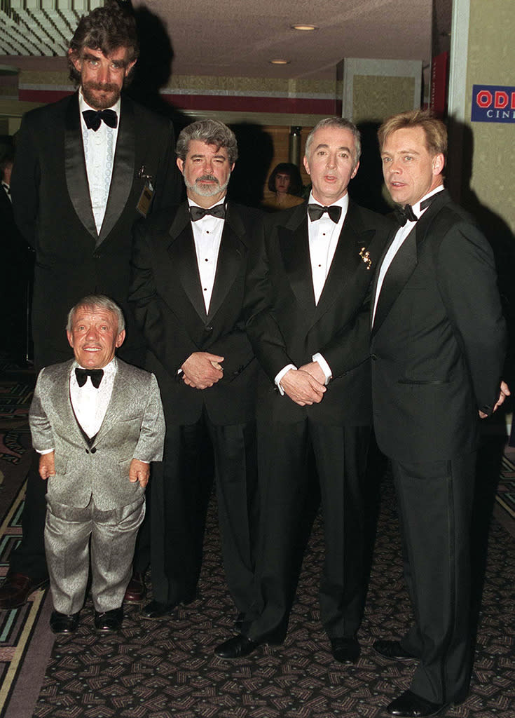 <p>(From left) Mayhew, Baker, Lucas, Anthony Daniels (C-3PO) and Hamill celebrated the re-release at the London premiere of <i>Star Wars</i> on March 20, 1997. (Photo: Tim Graham/Getty Images)</p>