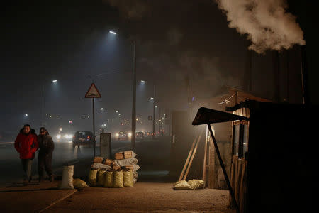 Bags of coal and wood are offered for sale in central Ulaanbaatar, Mongolia January 26, 2017. REUTERS/B. Rentsendorj