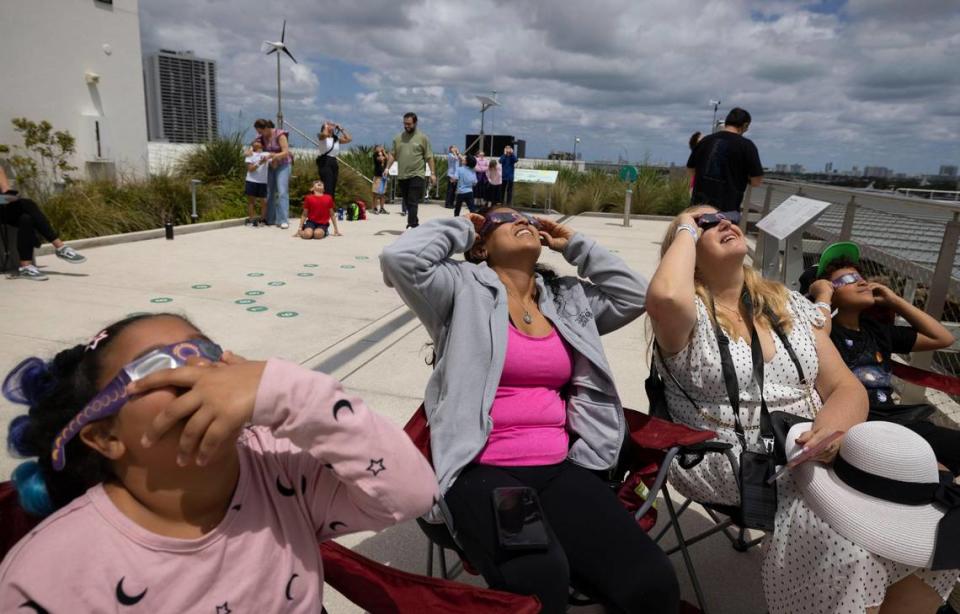 Andrea Victoriano, 10, left, Esperanza Salcedo, Joanna Fijalkowska and Emanuel Victoriano watch in Miami.